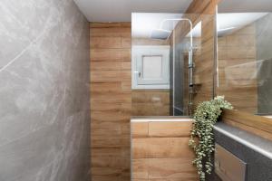 a bathroom with a sink and a mirror at Antigone View Apartments in Skala Potamias +177 photos