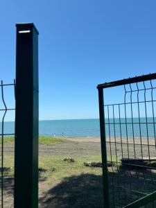 a view of the beach from behind a fence at Oxygen Hotel in Shekvetili