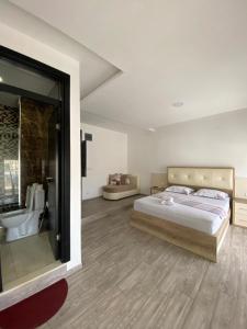 Llit o llits en una habitació de Seafront Apartments