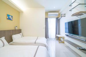 TV a/nebo společenská místnost v ubytování Mu Xia Homestay