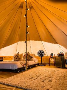 a bedroom with a bed in a large tent at Santuario Deluxe in Trujillo +35 photos