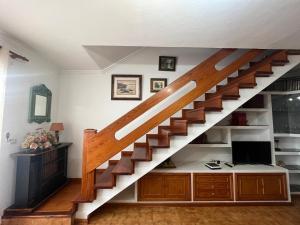 a staircase in a home with a desk underneath it at Saltflat2, be surrounded by sun, water and peace in Los Cancajos