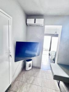 Televisor o centre d'entreteniment de PDC Rhodes