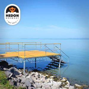 a dock with a bed in the water at Hedon Brewing Niko apartment - 200 meter to the Beach in Balatonvilágos