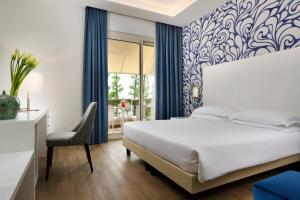 Łóżko lub łóżka w pokoju w obiekcie Hotel Continental Wellness & Spa