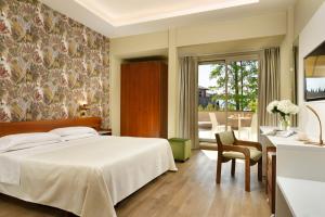 Łóżko lub łóżka w pokoju w obiekcie Hotel Continental Wellness & Spa