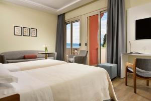 Łóżko lub łóżka w pokoju w obiekcie Hotel Continental Wellness & Spa