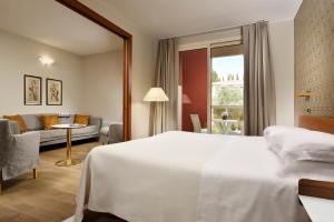 Łóżko lub łóżka w pokoju w obiekcie Hotel Continental Wellness & Spa