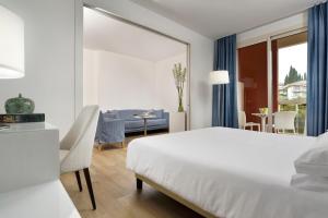 Łóżko lub łóżka w pokoju w obiekcie Hotel Continental Wellness & Spa