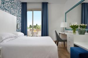 Łóżko lub łóżka w pokoju w obiekcie Hotel Continental Wellness & Spa