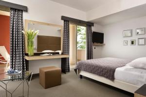 Łóżko lub łóżka w pokoju w obiekcie Hotel Continental Wellness & Spa