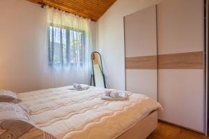Katil atau katil-katil dalam bilik di Dada Holiday Home