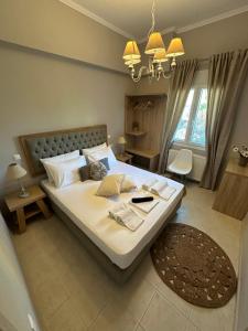 מיטה או מיטות בחדר ב-ILIOS apartment