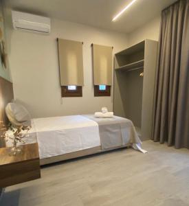 Postel nebo postele na pokoji v ubytování Αura Luxury Apartments