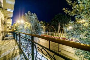 een hek met lichten erop naast een straat bij Apartment VIP MARIOTT in Baku