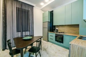 Kjøkken eller kjøkkenkrok på Apartment VIP MARIOTT