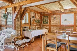 a dining room with a table and chairs at AVILA in Niechorze