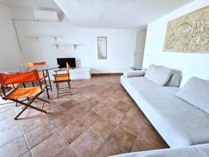 a living room with a couch and a table at Maridea - Il Borgo in Ponza