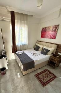 Ένα ή περισσότερα κρεβάτια σε δωμάτιο στο Pamukkale Sahin Boutique Hotel