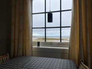 a window in a room with a table and a view at Feriehus i Salttjern in Vadsø