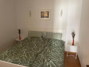 a bedroom with a bed and two vases on tables at Villa Los Silos in Costa Calma +8 photos