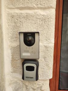 a camera and a toaster on a wall at La Cas d Zii la Giulia in Bari