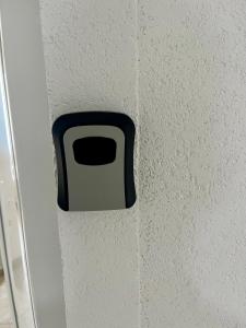 a black and white socket on a wall at Lux Ohrid in Ohrid