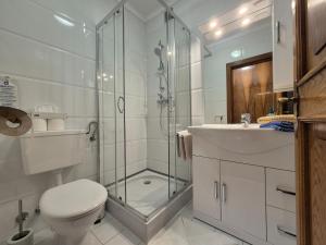 Koupelna v ubytování Hotel Garni Hutter