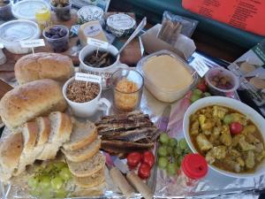 a tray of food with bread and different types of food at Kingfisher by the river - self catering in Velddrif
