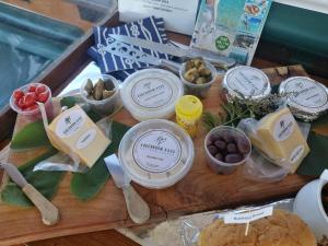 a wooden table with various food items on it at Kingfisher by the river - self catering in Velddrif