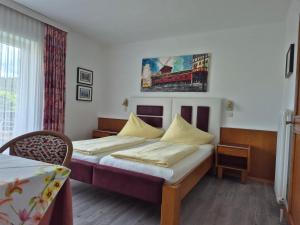 Postel nebo postele na pokoji v ubytování Hotel Garni Hutter
