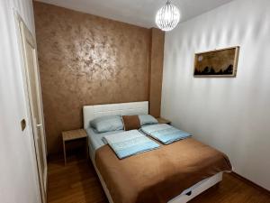 Postel nebo postele na pokoji v ubytování Apartman Alibi