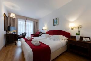 Postel nebo postele na pokoji v ubytování Hotel Hannover