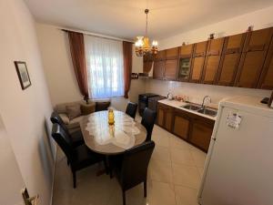 a kitchen and dining room with a table and chairs at Lisica in Bibinje