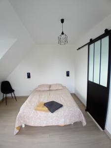 Ένα ή περισσότερα κρεβάτια σε δωμάτιο στο Chambre d'hôtes
