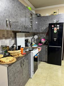 Kuchyň nebo kuchyňský kout v ubytování Martha Guest House