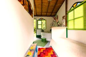 a bathroom with a bed and a tub in a room at Kantarrana Casa de Campo in Jardin
