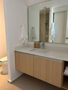 a bathroom with a sink and a mirror at Aria Ocean Playa Nuevo Vallarta in Nuevo Vallarta 