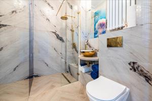 Koupelna v ubytování Apartament Meduza Nadmorskie Miejsce + 22 fotografií