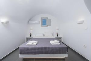 Voodi või voodid majutusasutuse Golden View Suites toas