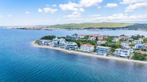 an aerial view of a resort on a island in the water at Vila Niko Dalmacija in Sukošan