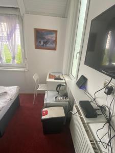 TV o dispositivi per l'intrattenimento presso Homestay U Hanky