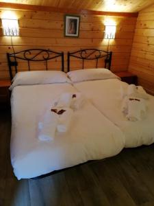 Łóżko lub łóżka w pokoju w obiekcie Cabañas Miraduero