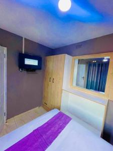 Кровать или кровати в номере Greyview