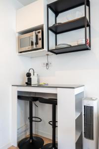 Kuchyň nebo kuchyňský kout v ubytování Studio cosy RDC, calme avec cour extérieure + 3 fotografie