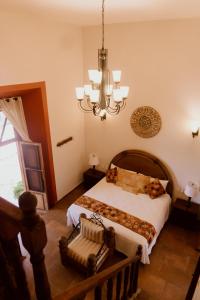Postel nebo postele na pokoji v ubytování Hacienda San Nicolas de las Fuentes