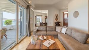 a living room with a couch and a table at Villa Marisol in Pollonia