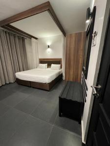 מיטה או מיטות בחדר ב-Ivory Residences