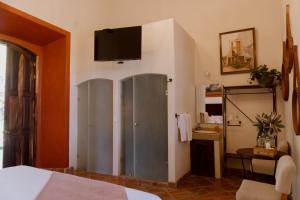 TV a/nebo společenská místnost v ubytování Hacienda San Nicolas de las Fuentes