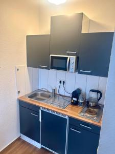 O bucătărie sau chicinetă la Five O - FeelGood-Apartment Goethe +3 fotografii